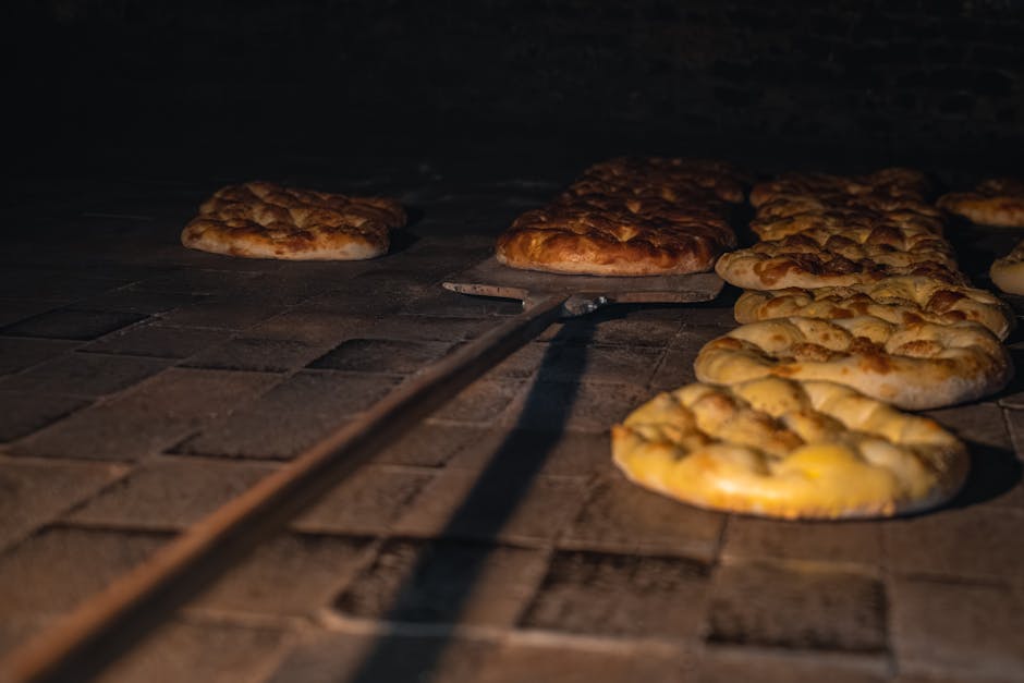 Golden brown loaves in a traditional stone oven, capturing the essence of artisanal bread making.